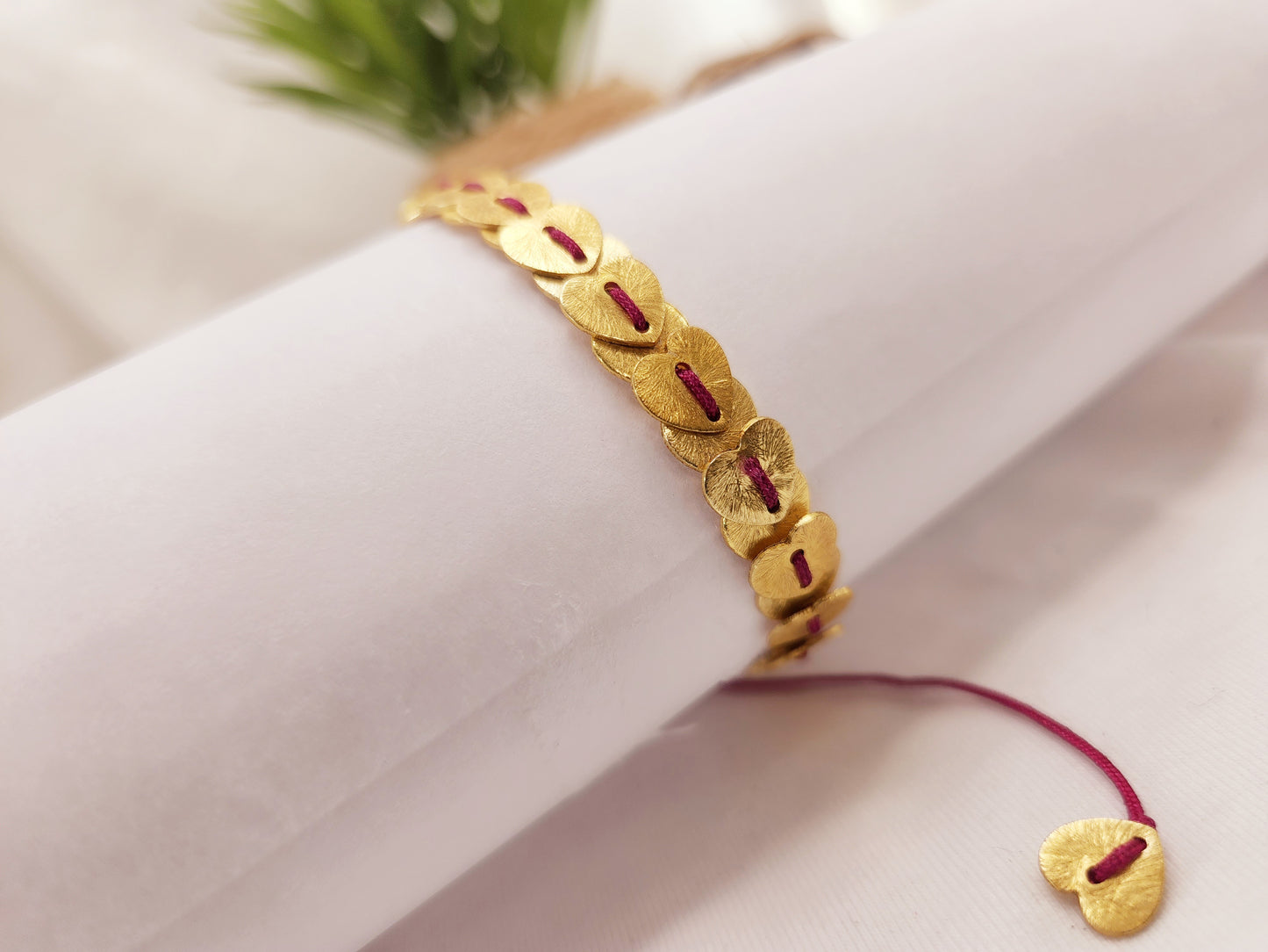 Thread bracelet with brushed gold heishi beads