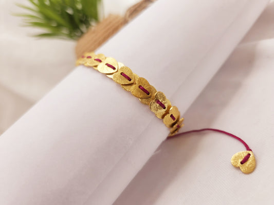 Thread bracelet with brushed gold heishi beads