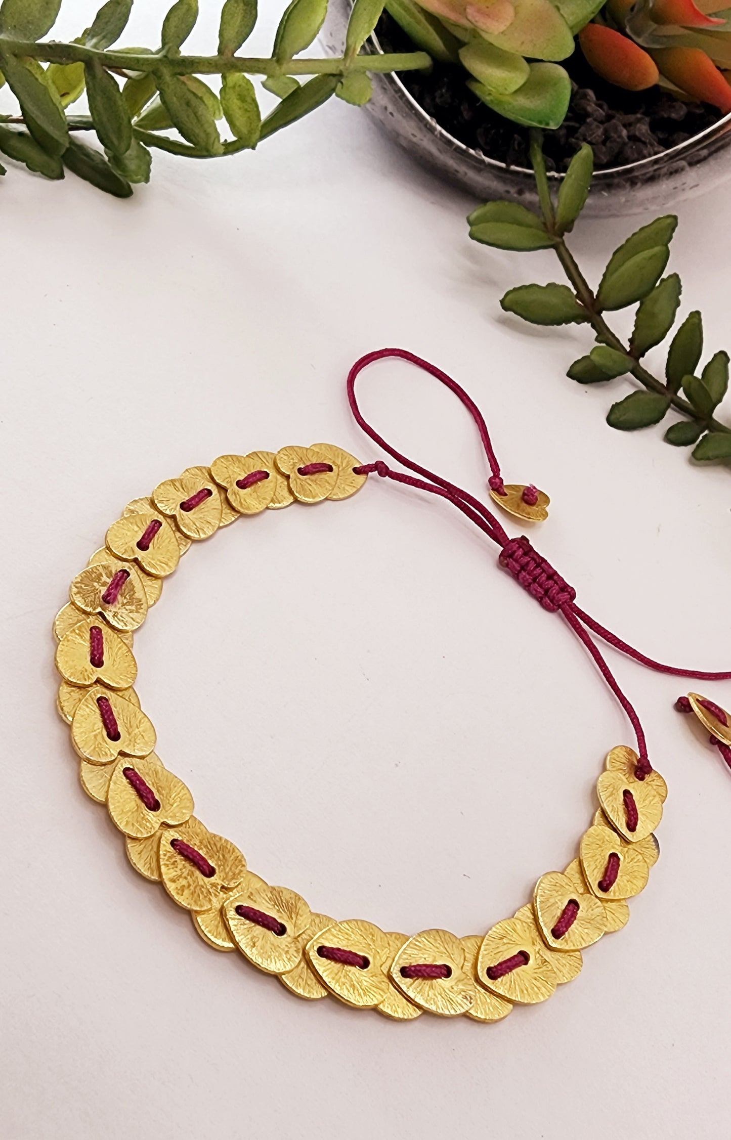 Thread bracelet with brushed gold heishi beads